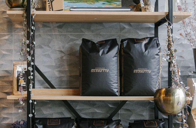 Bags of Allpress coffee on shelves at Westend Stories.