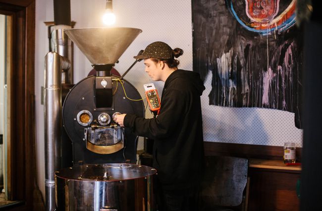 A man roasting coffee.