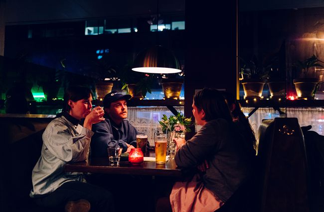 People drinking at a table.