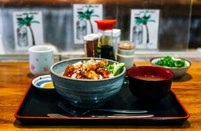 A Japanese bowl and miso soup on a counter.