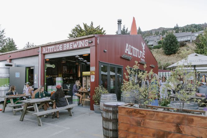 The red exterior of Altitude Brewing in Queenstown on a grey day.