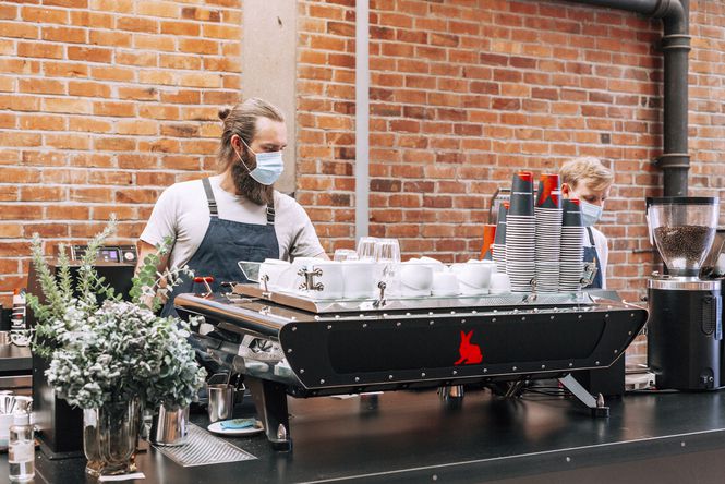 A barista making coffees at Red Rabbit Coffee Co.