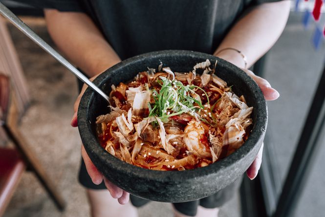 A bowl of sizzling bibimbap slathered in house-made gochujang sauce from Simon and Lee.