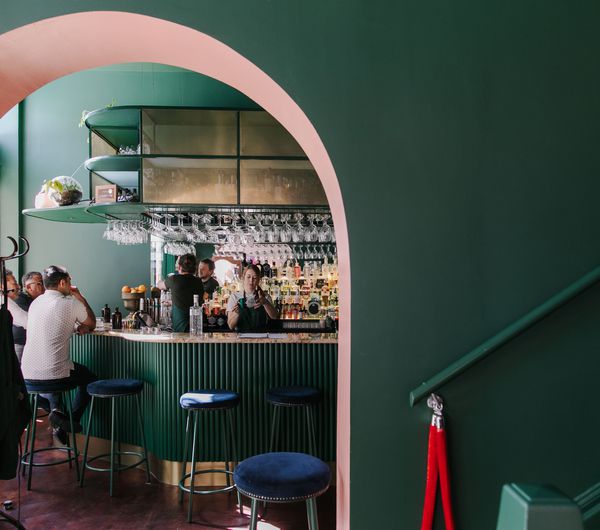 Interior view of gin gin feature green and pink contrast archway.