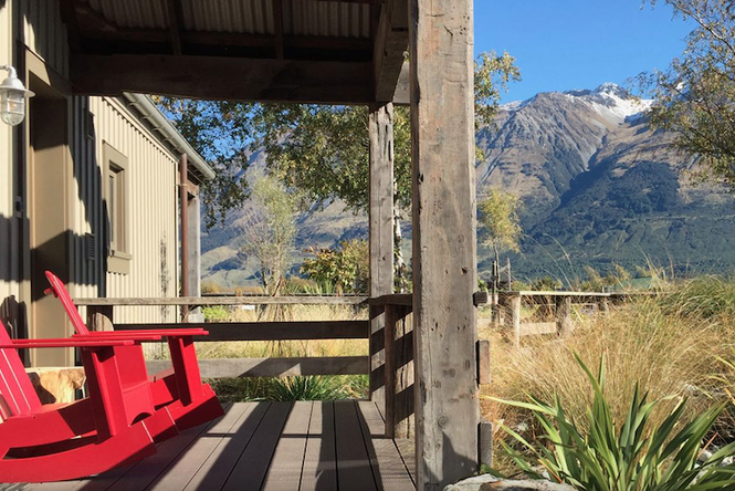 Red seats looking out to the mountains at Camp Glenorchy.