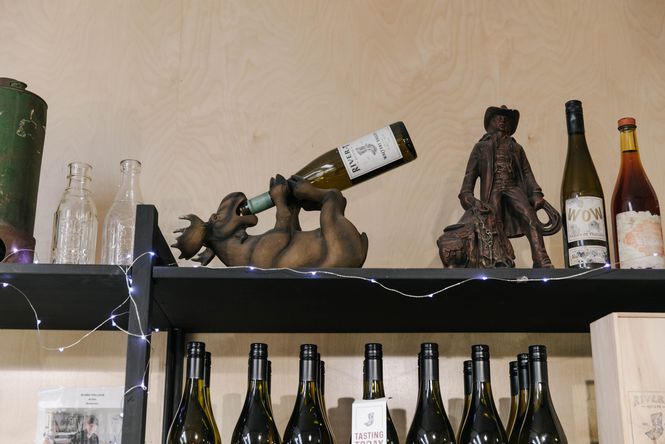Close up of wine bottles on display.