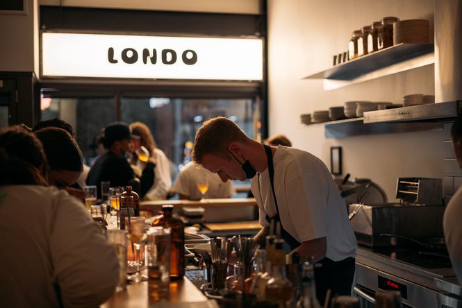 A chef at work behind the counter at Londo.